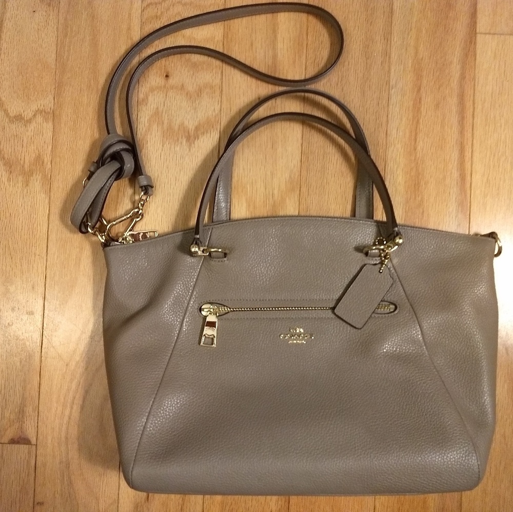 Cross body or hand grip Coach handbag